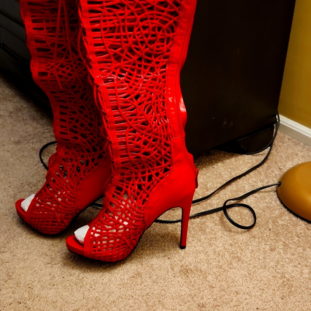 Red knee length boots